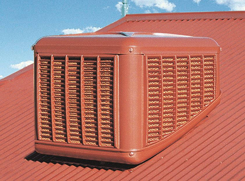 Colour coordinated evaporative air conditioning units are mounted discretely on the roof to deliver cooled and filtered air to rooms and large spaces via ducts and vents, or a plenum.